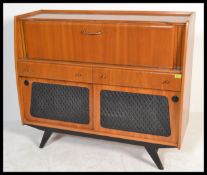 A stunning mid 20th Century walnut cased cocktail cabinet, full length full front cupboard glazed to