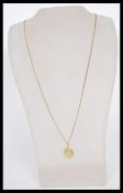 A hallmarked 9ct gold St Christopher's necklace pendant set to a 9ct gold necklace chain. Total