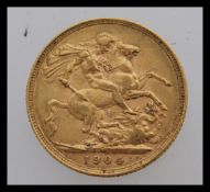 A 1904 gold sovereign featuring King George VII facing the right and a George dragon design on the