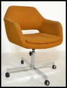 A retro 20th Century office desk swivel chair, orange woolen upholstery, raised on a chrome