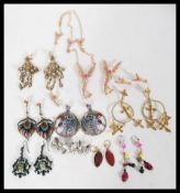 A collection of costume jewellery to include a set of fairy items with inlaid pink stones, a pair of