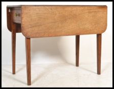 A 19th Century Victorian oak and elm drop leaf Pembroke dining table fitted with a single drawer