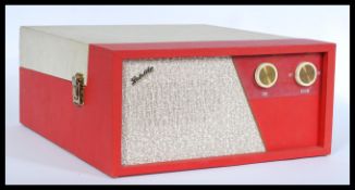 A vintage retro 20th century Fidelity portable picnic record player having a BSR deck set to a two