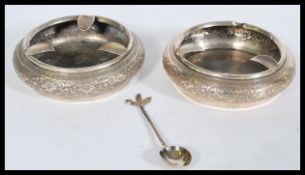 A pair of Persian Islamic ashtrays of bulbous form with floral detailing to the outside, items