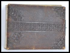 A 19th century leather CDV album having metal lock with gilt page ends containing a collection of