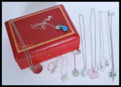 A group of nine sterling silver necklaces and pendants all stamped 925 to include fairy,