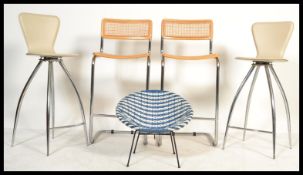 A pair of chrome framed cantilever bar stools, a pair of Italian chrome framed with leather seats