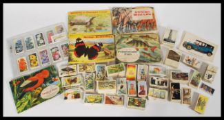 A collection of cigarette cards and tea cards including a collection of 'Wildlife in Danger' by