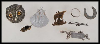 A group of vintage jewellery to include a silver 3d owl brooch with yellow glass eyes. silver