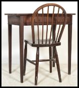 An Edwardian mahogany writing table desk being raised on square tapering legs with single drawer