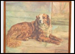 A vintage 20th century oil on canvas painting of a border collie dog in a reclined position signed
