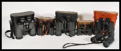 A group of vintage binoculars to include Bushwell, Tohyoh, Prinz, Commodore etc. Most in cases