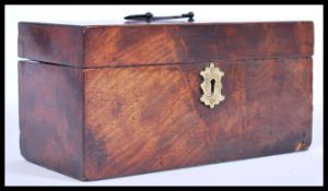 A 19th century Georgian mahogany tea caddy, with a scrolled swing handle, inlaid mother of pearl