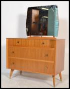A retro 20th Century dressing table chest by Austin Suite, three drawers with mirror to the top
