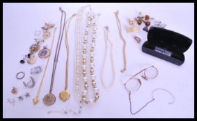 A group of 9ct gold and vintage costume jewellery to include a hallmarked locket pendant, gold