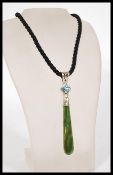 A vintage plain band necklace with a 925 silver clasp and setting with inlaid rhinestone and green