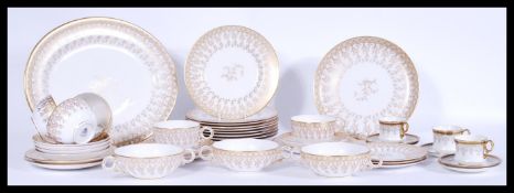 A vintage 20th Century Royal Worcester bone China part service, ornately decorated in gilt