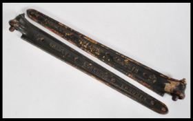 A pair of 19th century large black painted cast iron hinges stamped Charles Collinge Lambeth