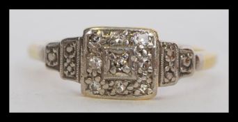 A 20th century Art Deco 18ct gold and diamond ring set with diamonds into a platinum square mount.
