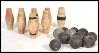 A set of vintage early 20th century wooden pub bowling pins / skittles complete with a group of