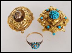 A collection of Victorian 19th century jewellry to include a a gilt pendant with ornate scroll
