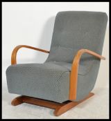 A retro 20th Century beech bentwood sprung rocking chair - armchair, button back upholstery.