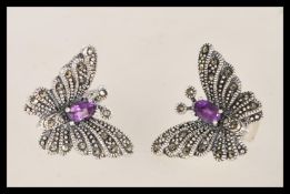 A pair of vintage 20th century butterfly stud earrings having prong set amethysts and and