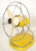 A fantastic mid 20th century Pifco desk fan, finished in vibrant yellow colourway in a stunning