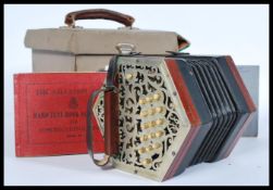 A mid 20th century Salvation Army rosewood squeeze box accordian musical instrument having a