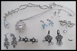 A collection silver of 20th century jewellery to include Victorian inspired scrolled bar brooch with