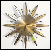 A vintage retro 20th century sunburst starburst sputnik atomic wall clock, with gilt dial and