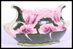 A 19th century Continental secessionist tube lined vase with floral detailing and shaped handles