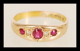A 19th century Victorian 15ct gold hallmarked gypsy set ring having inset red and white stones.