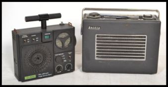 A vintage retro Hacker Herald transistor radio together with a Sonia Detonator radio receiver.