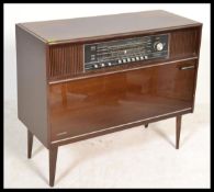 A vintage / retro radiogram music system housed within a lacquered cabinet, Lumophon radio display
