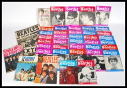 A collection of Beatles memorabilia to include The True Story of The Beatles 1964, The Beatles in