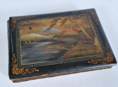 A vintage early 20th century lacquered postcard album containing a good group of postcards of Japan,