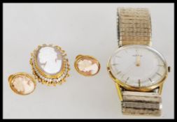 A collection of vintage jewellry to include a pair of stamped 9ct gold cameo earrings featuring