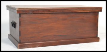A large 20th Century hard wood blanket box, expose
