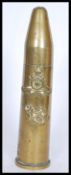 A vintage 20th century WW2 trench art table lighter made from a 1944 artillery shell with lid having