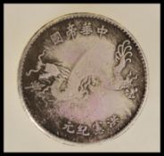 An early 20th century Chinese Dollar (Yuan) first year / starting year coin featuring Yuan Shikai as