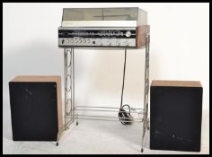 A 20th century Fidelity solid state player on stand with speakers.