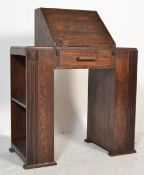 A 1930's Art Deco oak bureau desk having a central  kneehole recess with fall front cover with fully