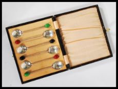 A collection of six early 20th century E and Co Birmingham silver spoons with coffee bean finials in