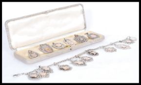 A collection of early 20th century silver and gold sporting medals including football and tennis