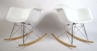 A pair of vintage 1950's style RAR rocking chairs after Charles and Ray Eames, with plastic