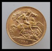 A 1911 half sovereign from the London Mint with a George and dragon design and a left facing king
