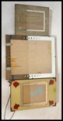 A collection of three early 20th Century picture frames to include wall hanging and easel.