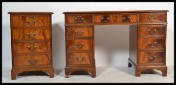 A good 20th Century contemporary yew wood twin pedestal desk, an arrangement of nine drawers,