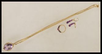A set of contemporary gold and purple stone jewellery to include a 9ct gold curb chain pendant